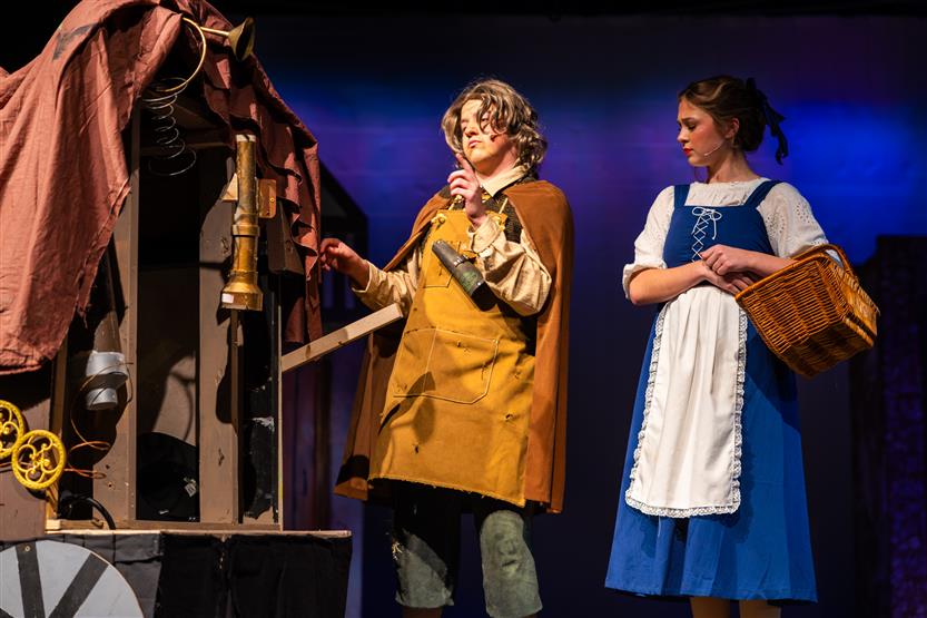 Actors perform onstage